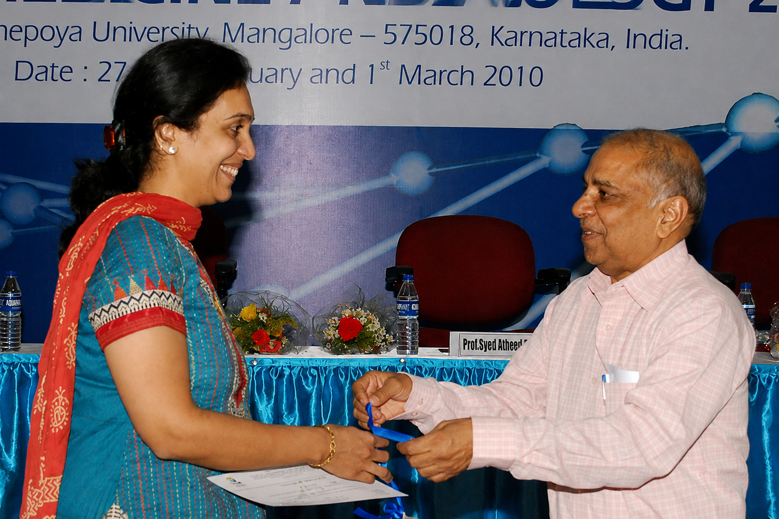 Dr. Vaishaly Bharambe being felicitated at Yenepoya University