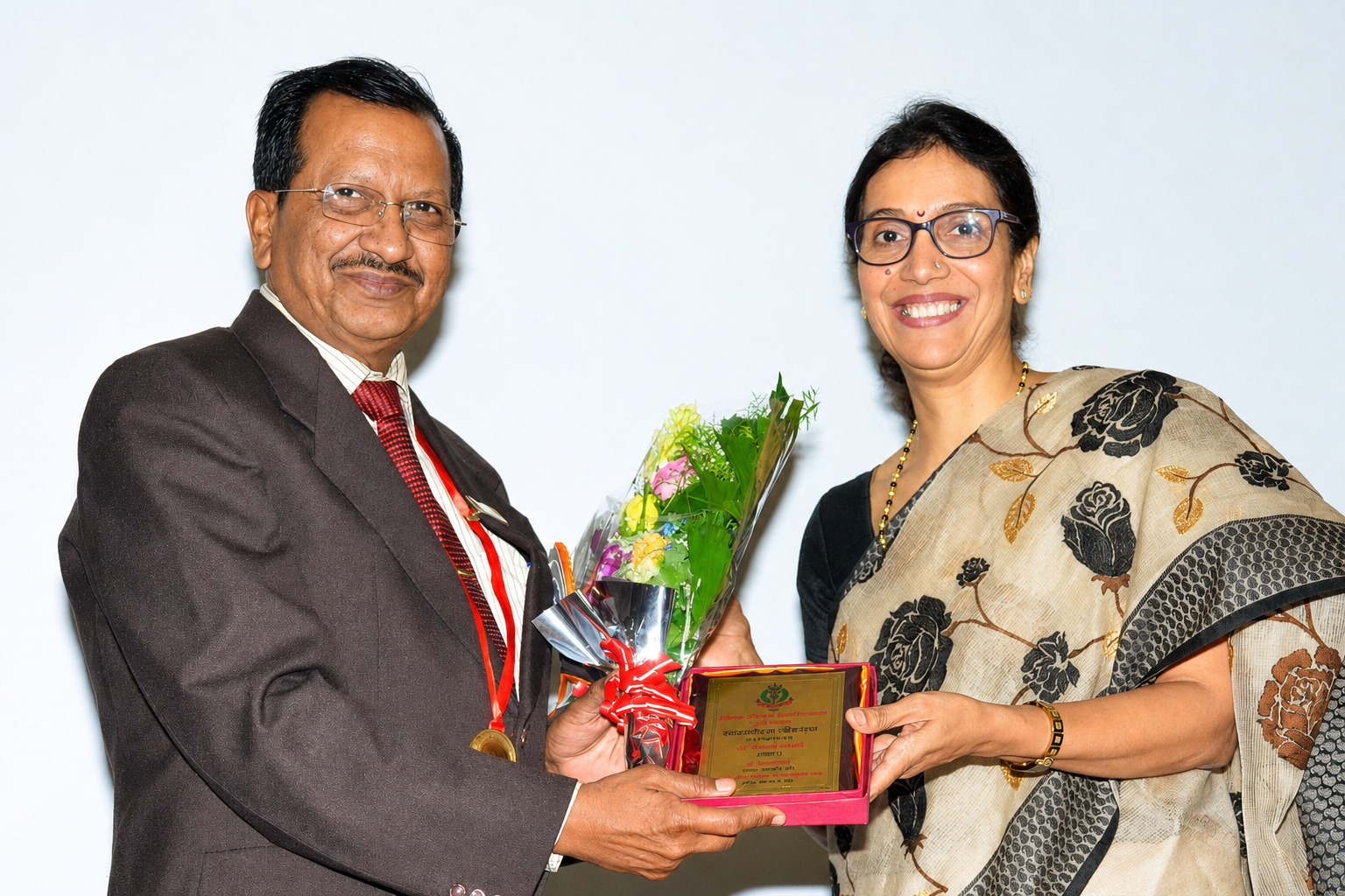 Dr. Vaishaly Bharambe receiving an award